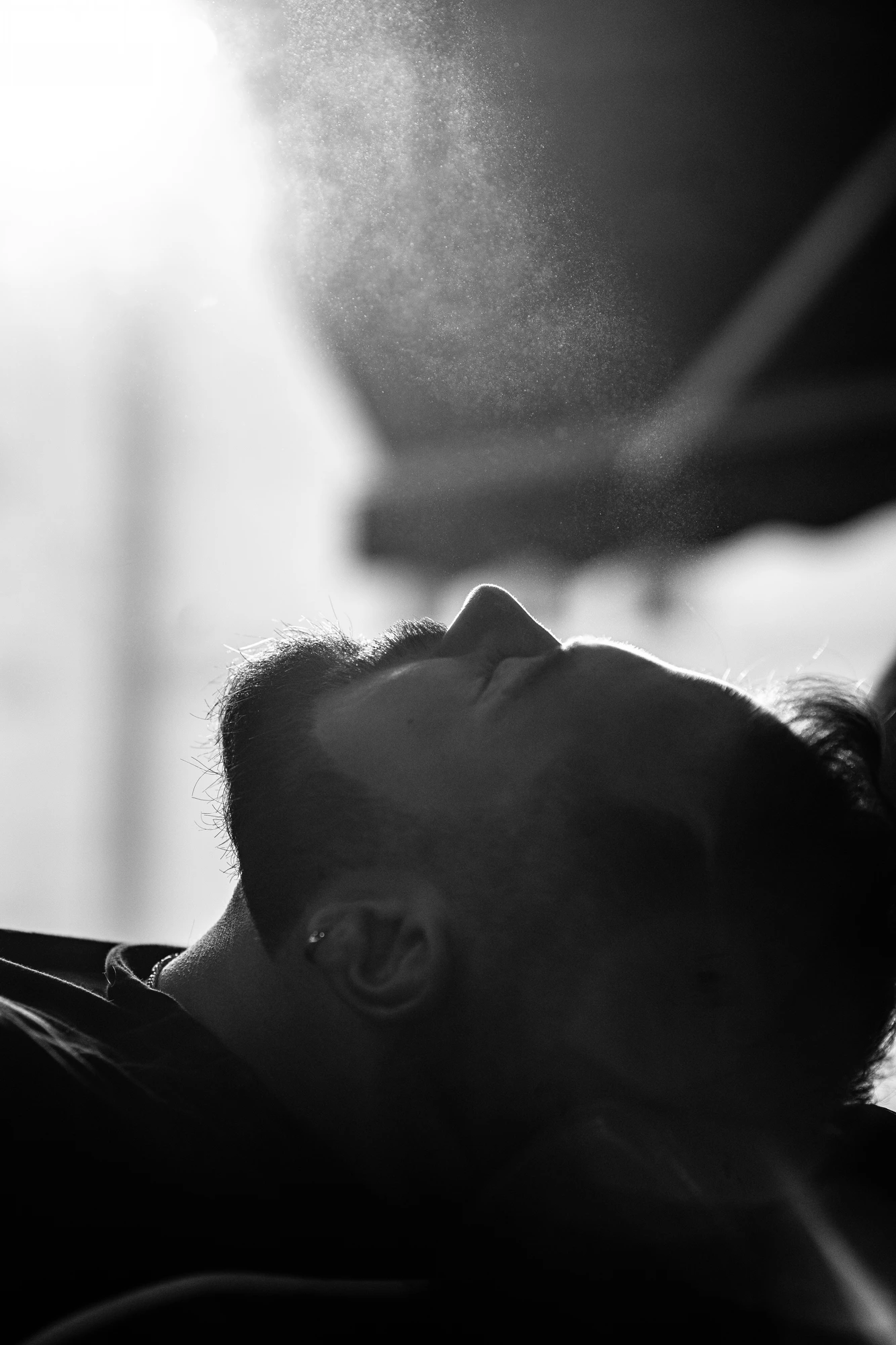 Silhouette with water vapor in backlight