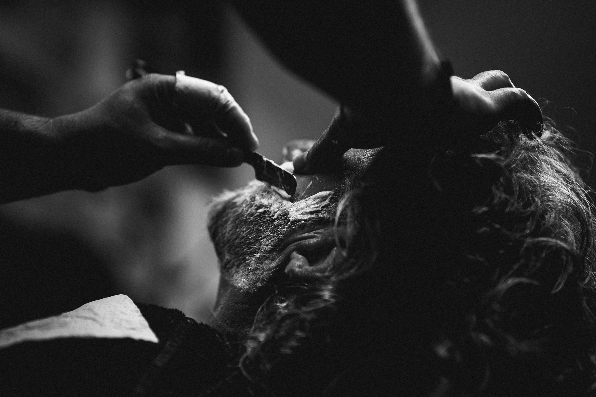 Razor that trims the gray beard in chiaroscuro